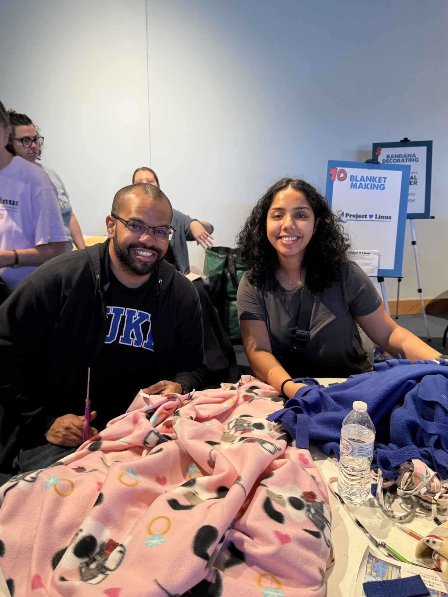 People making fleece blankets for Project Linus