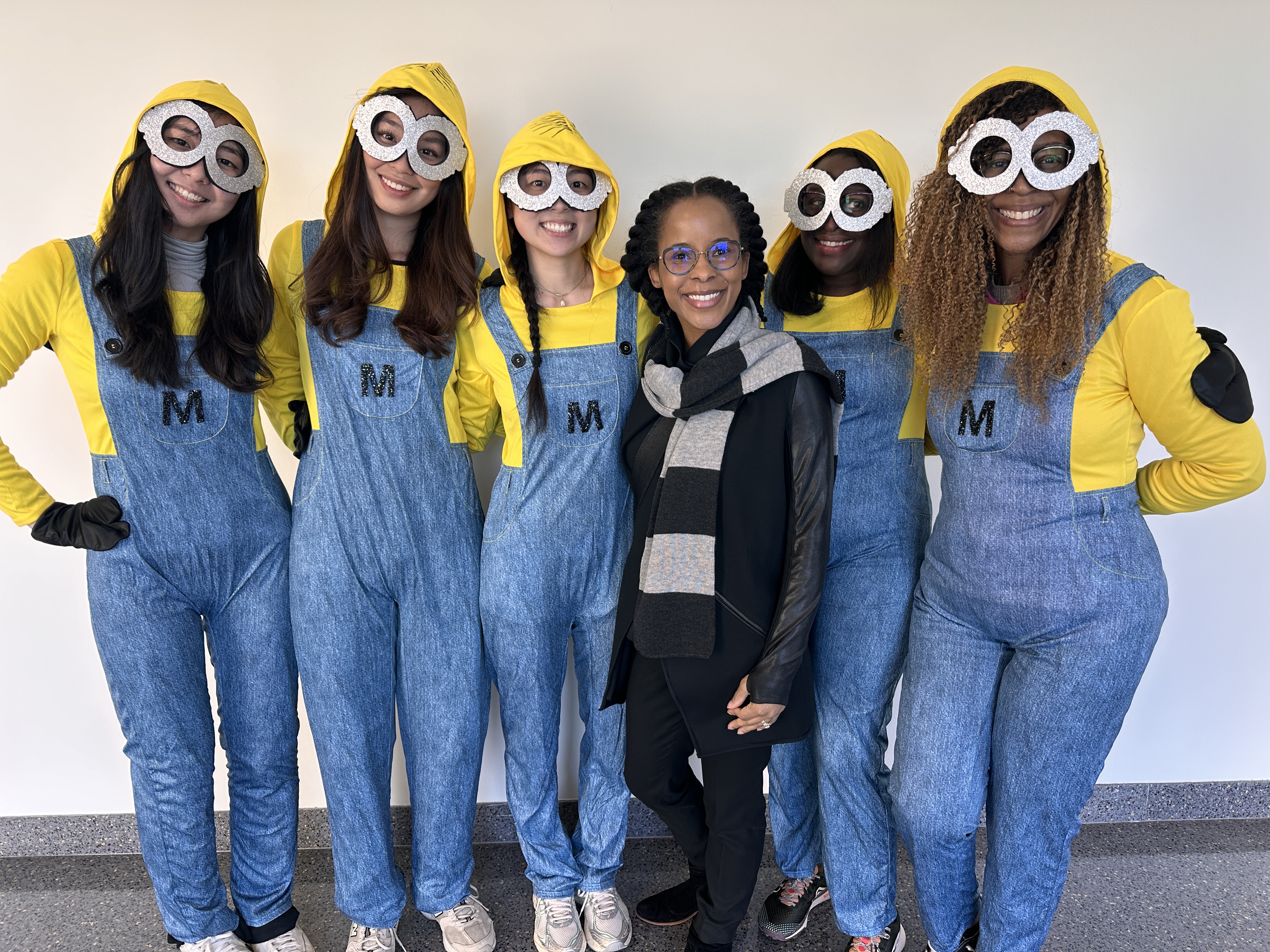 5 lab members dressed as minions with woman in the middle