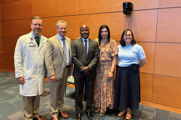 Dr. St. John with Symposium Leadership