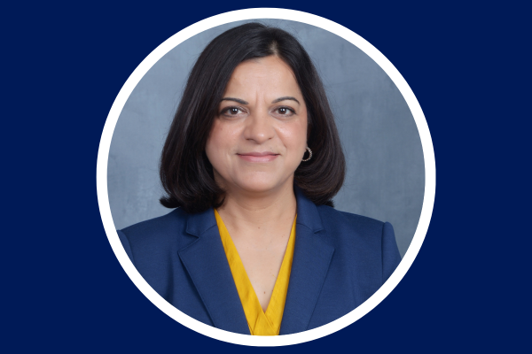 Headshot of Dr. Nidhi Mahendra on Duke blue background 