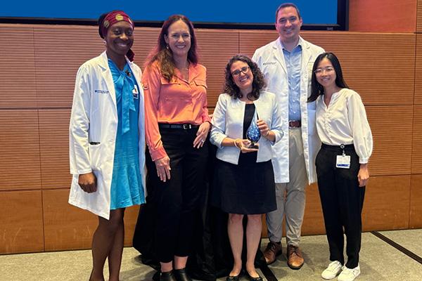 Photo of group including Somtochi Okafor, Dr. Collins, Dr. Cecelia E. Schmalback, Connor Pratson, and Debbie Pan