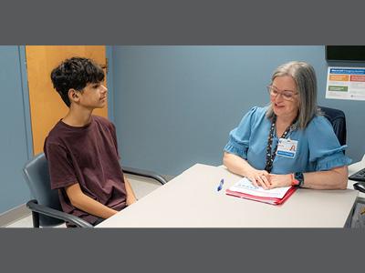 Andy Torres works with speech pathologist Megan Katz at the Duke Speech Pathology and Audiology Clinic.
