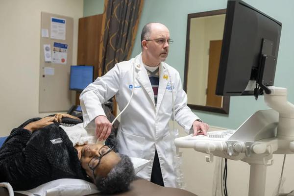 A physician examining a patient