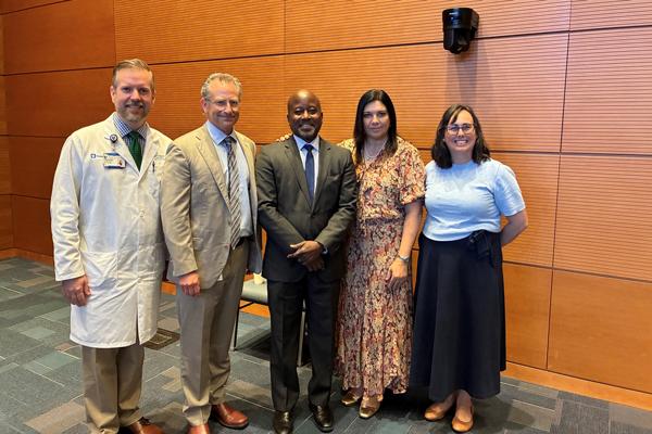 Dr. St. John with Symposium Leadership