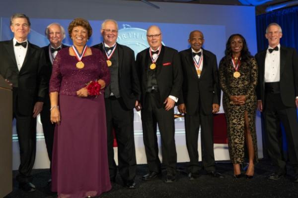 Dr. Wilson and others on stage