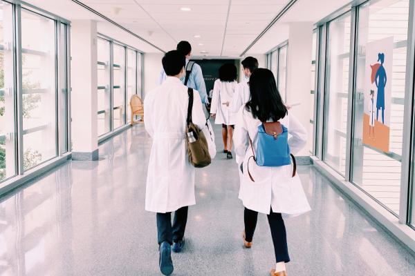 Interns walk the halls of Duke University Hospital during their first day of residency in 2021.