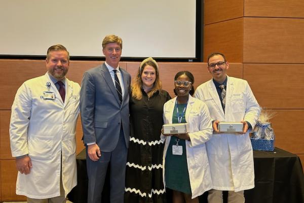 Dr. Woodard, Fisher family, and two residents