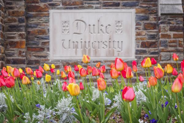 Duke University sign with flowers in front