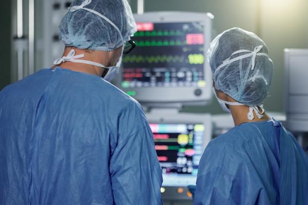 Two doctors looking at a screen