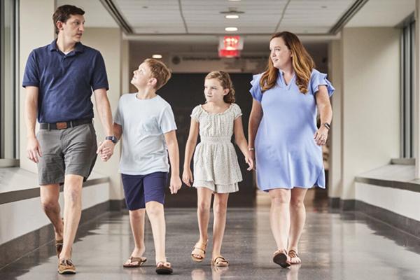 McFadden family walking in the hallway at Duke Hospital