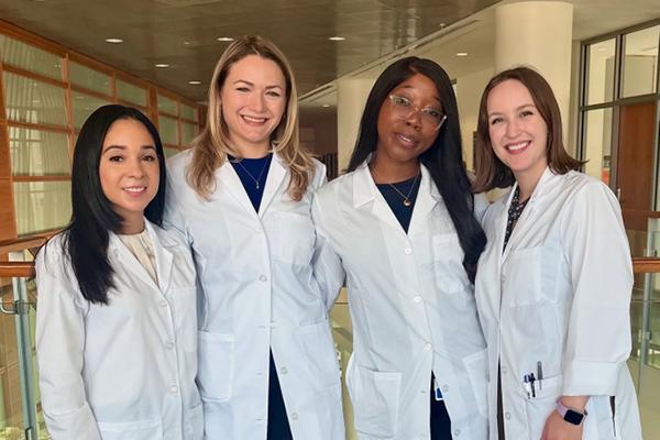 PGY1 residents standing together in a group, smiling 