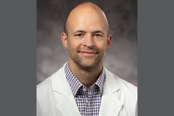 Headshot of Dr. Kahmke on gray background