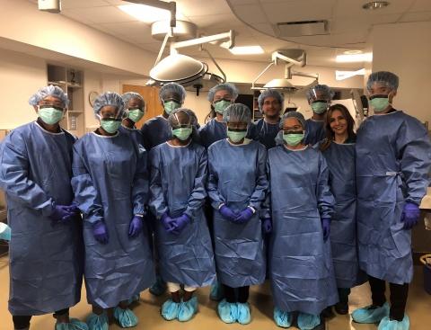 Durham high school students gowned up in the Duke Fresh Tissue Laboratory