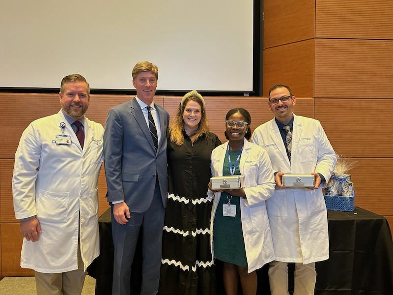 Dr. Woodard, Fisher family, and two residents