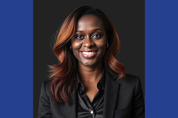 Headshot of La'Toria Jallah on blue background