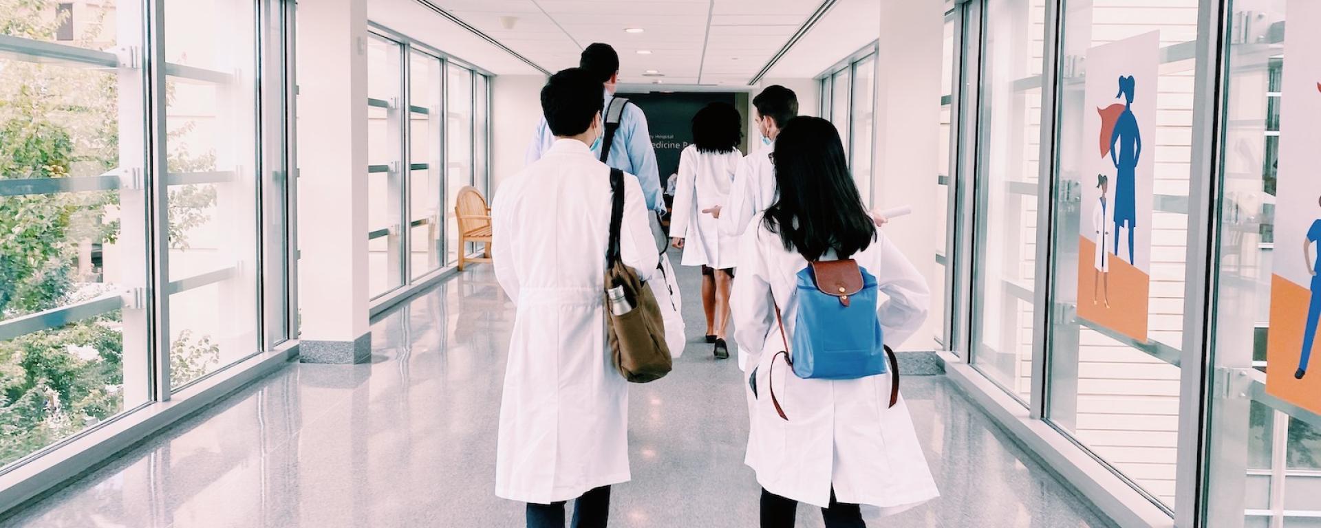 Interns walking down corridor