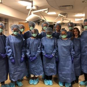 Durham high school students gowned up in the Duke Fresh Tissue Laboratory