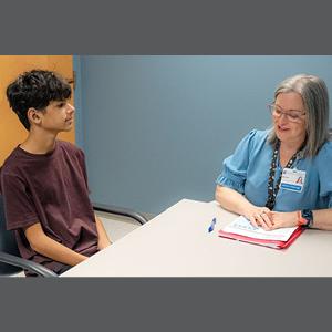 Andy Torres works with speech pathologist Megan Katz at the Duke Speech Pathology and Audiology Clinic.