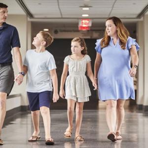 McFadden family walking in the hallway at Duke Hospital