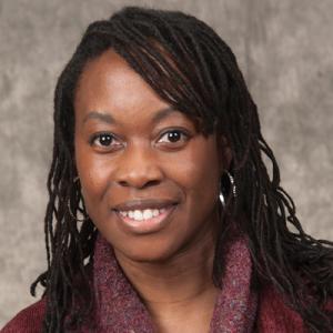 Headshot of Dr. Fannin on purple background