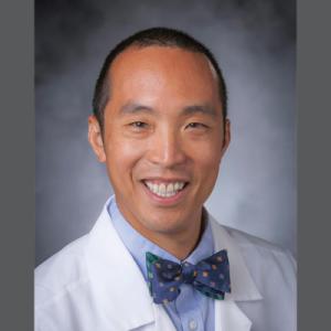 Headshot of Dr. Cheng on gray background 