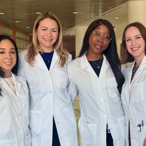 PGY1 residents standing together in a group, smiling 